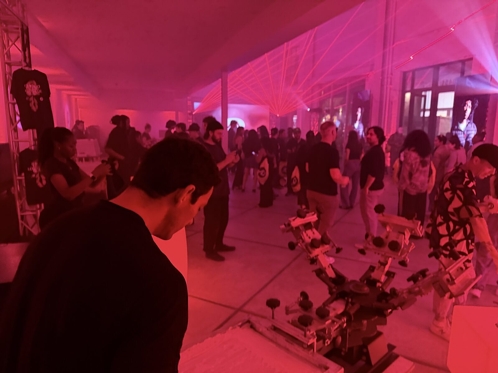 Personalization station operating inside a large tented event with guests circulating